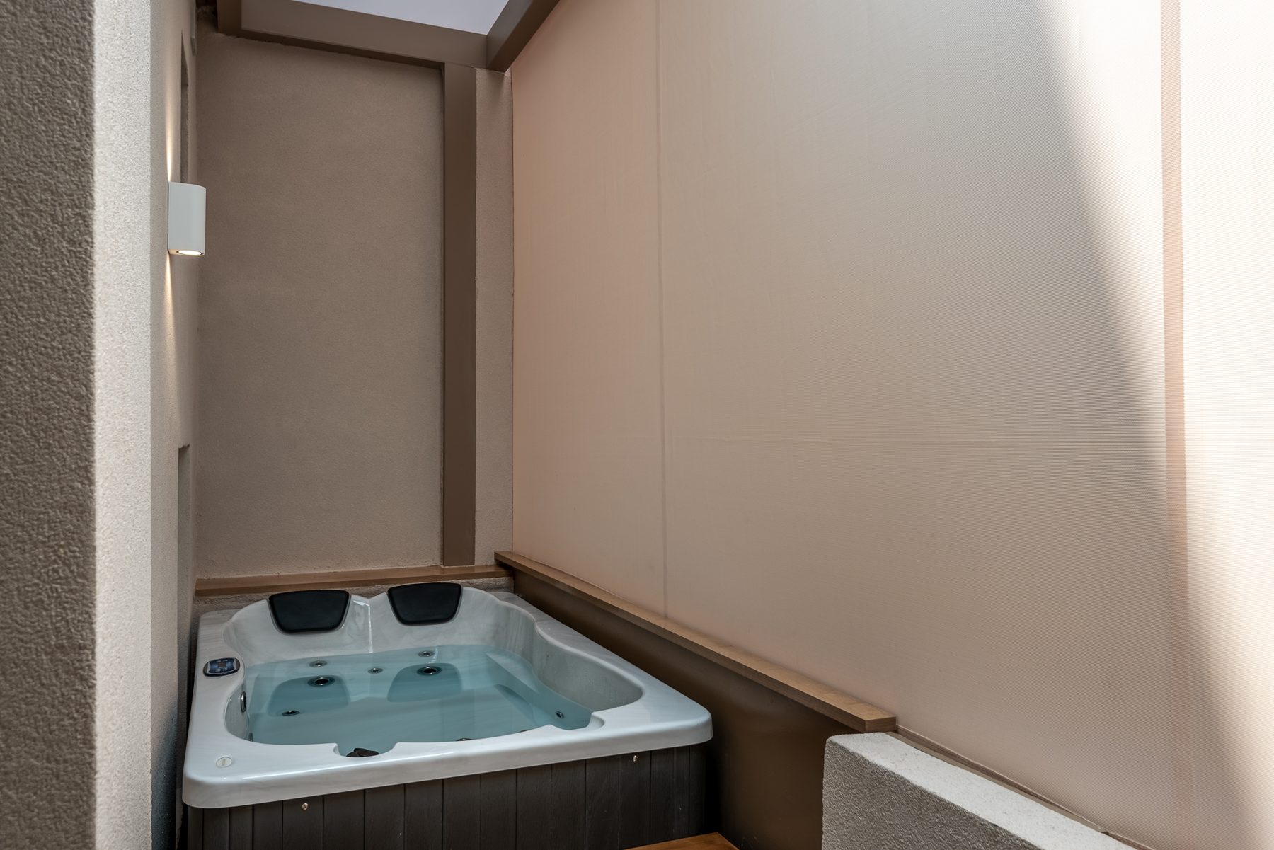 Devina One — private jacuzzi on the sheltered balcony