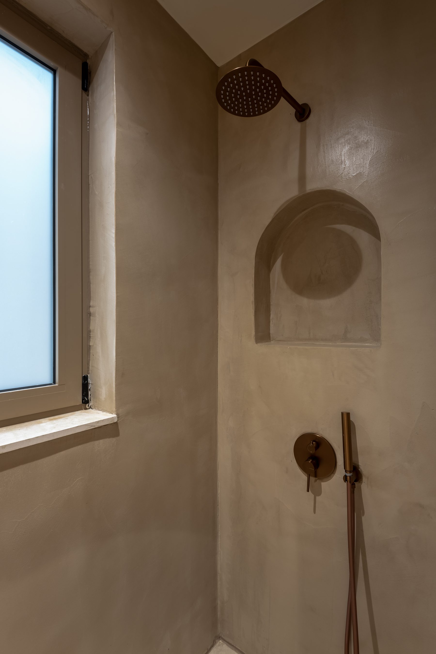 Devina Two — Ensuite 1, backlit mirror and matte sculptural fixtures