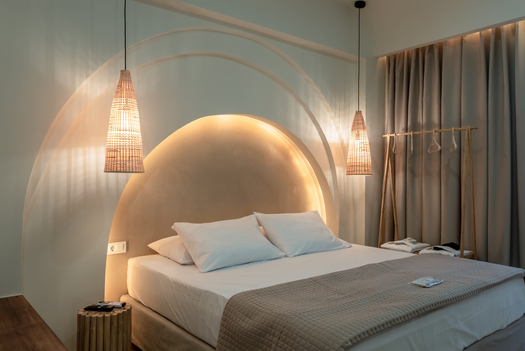 Devina Two — bedroom one with warm ambient lighting at dusk