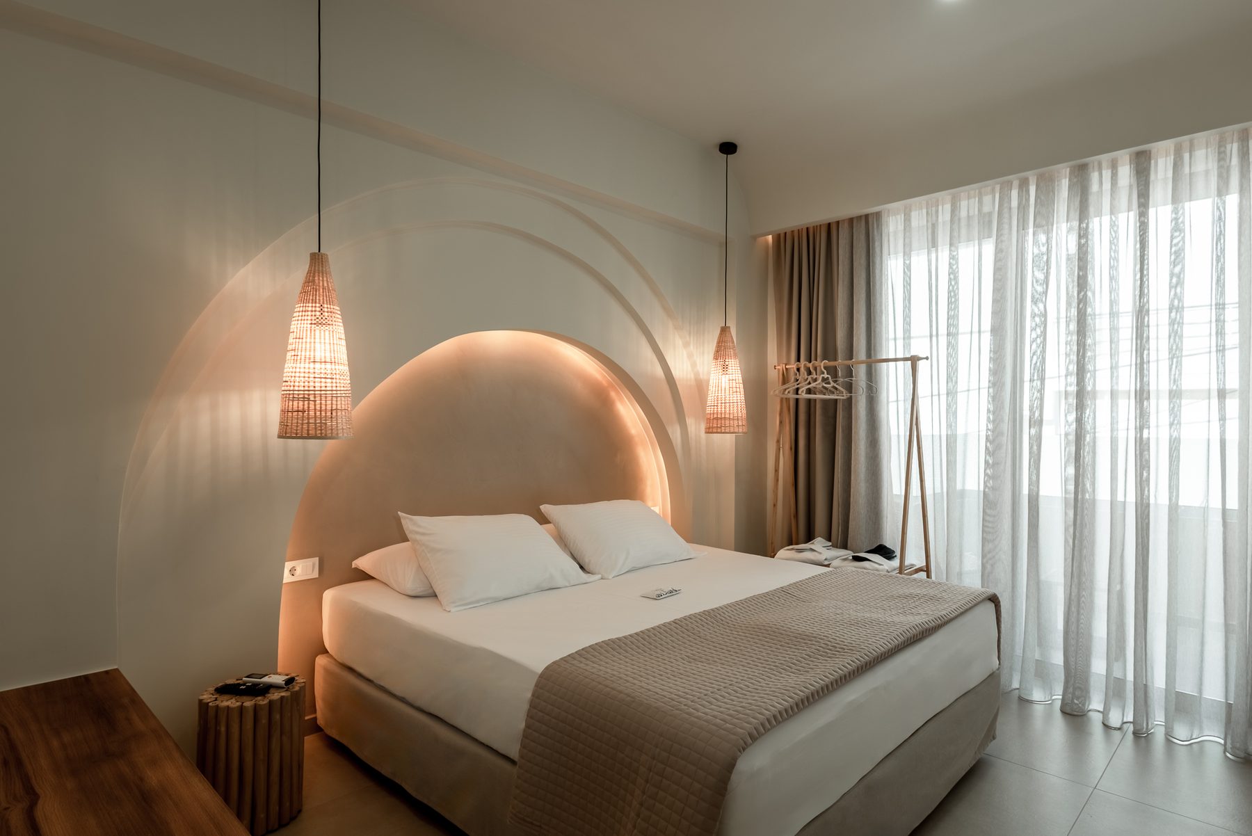 Devina Two — king bedroom two with arched window and soft linen tones