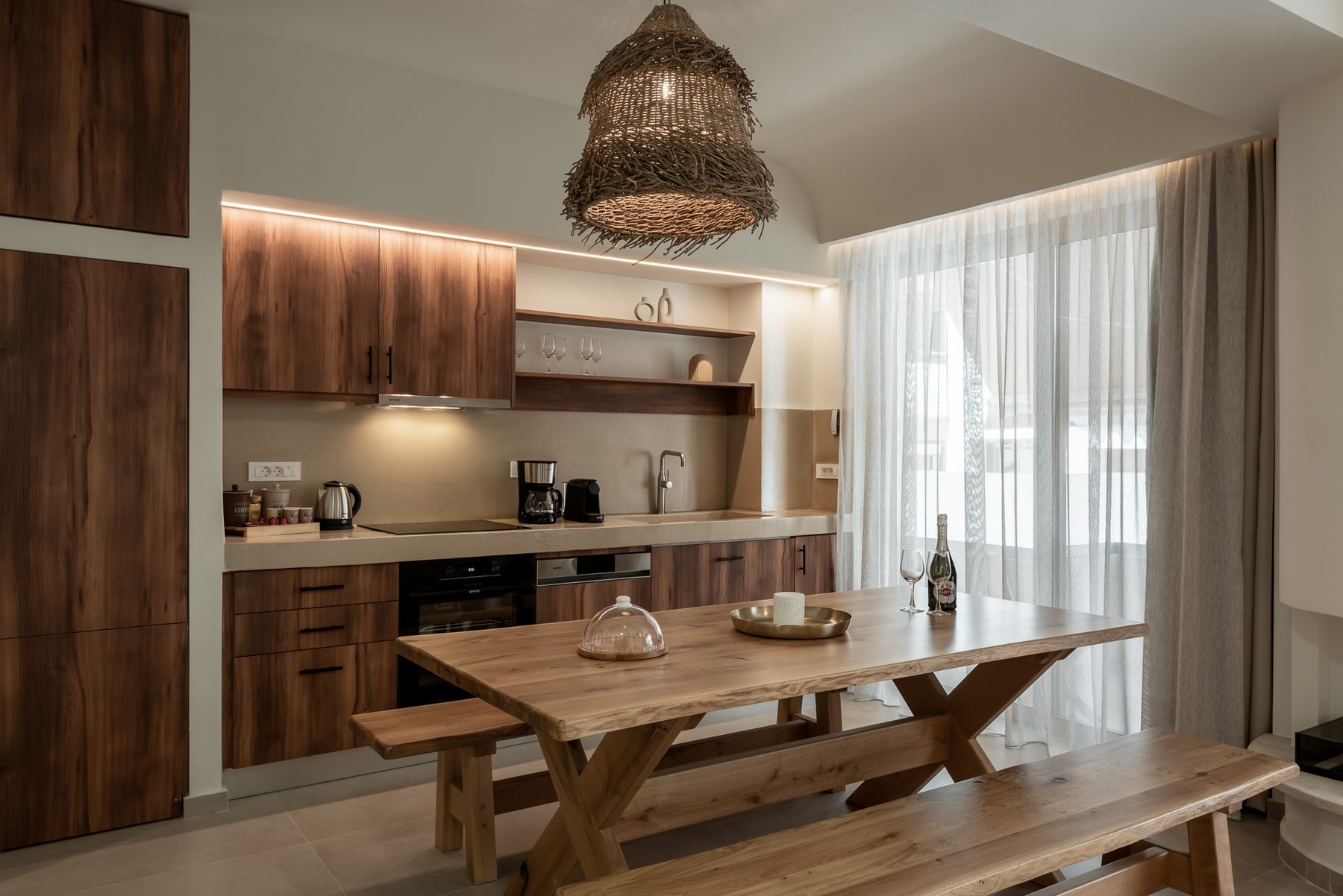 Devina Two — fully equipped kitchen with stone surfaces and open dining area